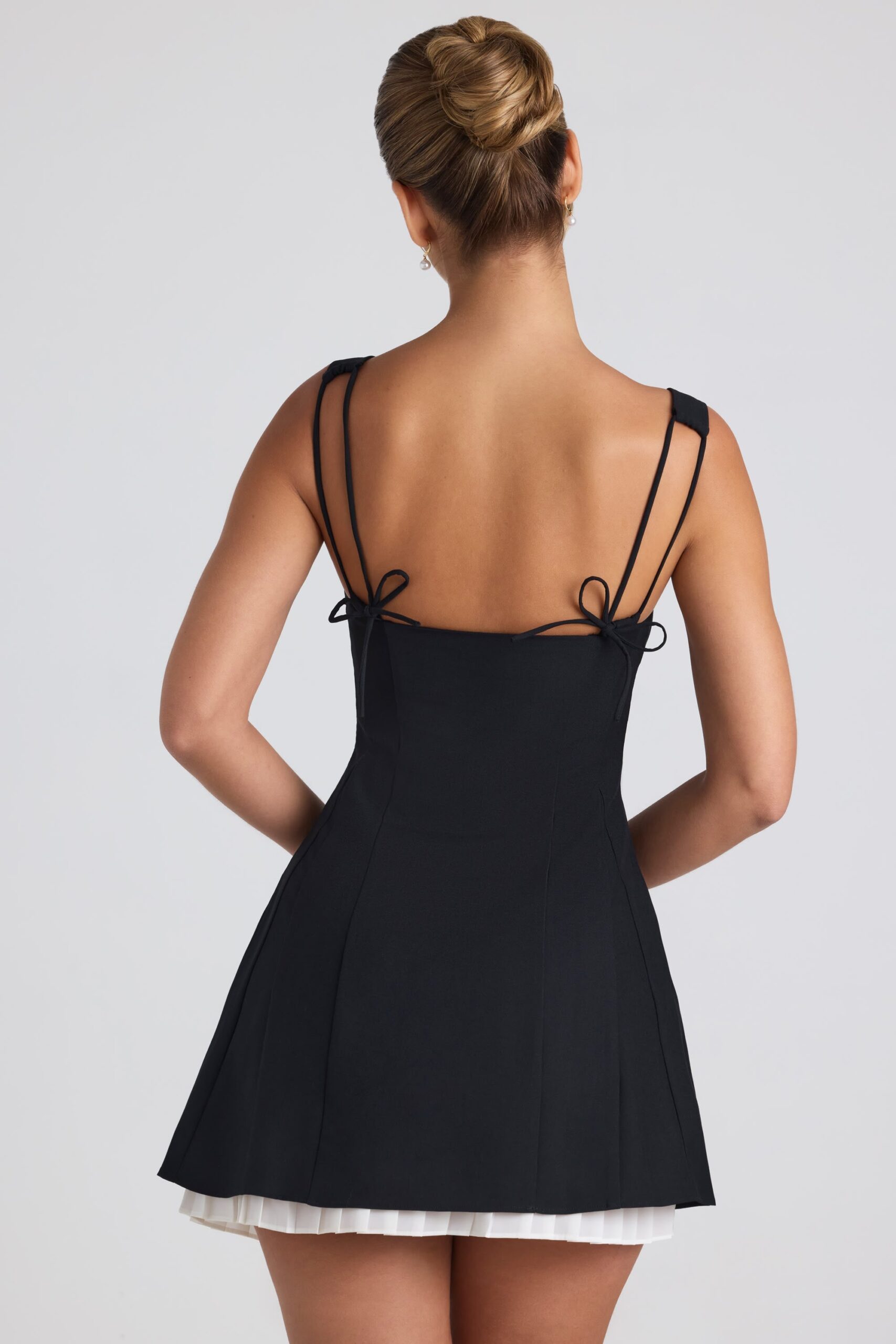 Bow-Detail Pleated A-Line Mini Dress in Black - Image 3